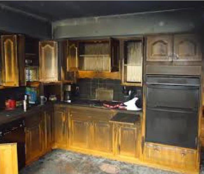 Burnt stove, burnt cabinets