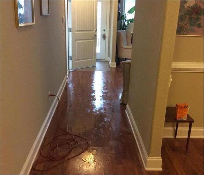 Wet floor inside a home. Concept of water damage.